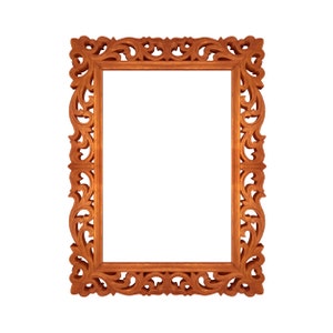 May include: A wooden picture frame with intricate carvings around the edges. The frame is a rich brown color and has a rectangular shape.