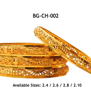 May include: Gold-colored bangles with intricate openwork designs. The bangles are stacked and displayed against a white background. The image includes the text "BG-CH-002" and available sizes: 2.4, 2.6, 2.8, and 2.10 inches.