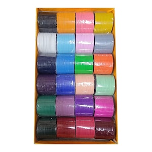 May include: A box of 24 colorful bangles, arranged in rows. The bangles are made of metal and have a shiny finish. The colors include white, light blue, pink, gray, black, dark blue, green, orange, peach, light green, purple, maroon, and red.