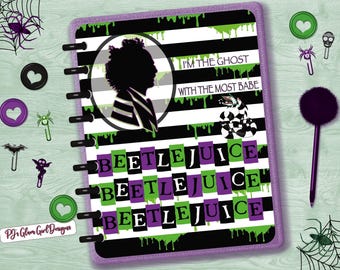 May include: A planner with a purple border, featuring a black and white striped design with green drips. The planner includes the text "BEETLEJUICE" and "I'M THE GHOST WITH THE MOST BABE". Decorative elements include heart-shaped buttons and spider web accents.