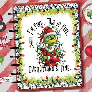 May include: A planner with a Grinch design, wearing a Santa hat and wrapped in Christmas lights. The text reads "I'm fine. This is fine. Everything's fine." The planner is surrounded by a red border and Christmas decorations.