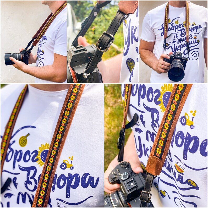 Puede incluir: Una correa de c&aacute;mara de cuero marr&oacute;n con un patr&oacute;n floral amarillo y naranja. La correa tiene el texto "Слава Україні" impreso en ella.