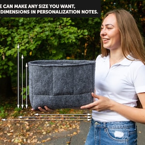 May include: A grey felt organiser with multiple compartments. The organiser is being held by a person. The text "WE CAN MAKE ANY SIZE YOU WANT, JUST WRITE DIMENSIONS IN PERSONALIZATION NOTES." is visible in the image.