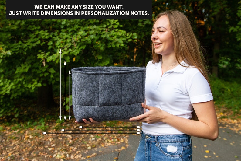May include: A grey felt organiser with multiple compartments. The organiser is being held by a person. The text "WE CAN MAKE ANY SIZE YOU WANT, JUST WRITE DIMENSIONS IN PERSONALIZATION NOTES." is visible in the image.