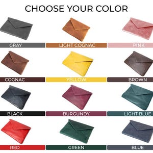 May include: A selection of 12 different colored leather envelope clutches. The colors include gray, light cognac, pink, cognac, yellow, brown, black, burgundy, light blue, red, green, and blue.