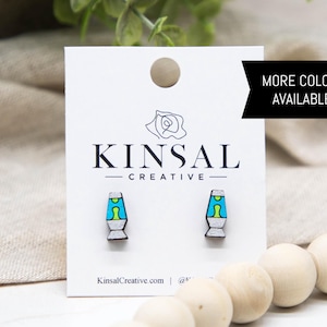 May include: Wooden stud earrings featuring a lava lamp design with a teal, yellow, and gray color scheme. The earrings are displayed on a white card with the text "KINSAL CREATIVE" and "MORE COLORS AVAILABLE!"