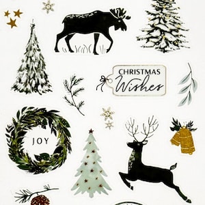 May include: A sheet of Christmas-themed stickers with various designs. Includes text that says "Merry Christmas" and "Christmas Wishes". Features images of a moose, Christmas trees, a wreath, a deer, bells, and a cabin.