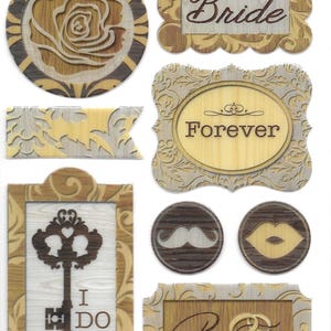 May include: A set of nine wood-look stickers with a wedding theme. The stickers feature a rose, a key, a mustache, lips, and various text including "Bride", "Forever", "I Do", and "Promise".