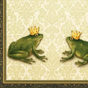May include: Two green frogs wearing gold crowns are featured in this image. The frogs are set against a cream-colored background with a repeating floral pattern. The image is framed with a dark green and gold border.