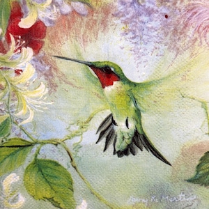 May include: A fabric print featuring a vibrant green hummingbird with a bright red throat patch in flight. The bird is surrounded by clusters of white and yellow honeysuckle flowers and soft purple blossoms against a light green background.