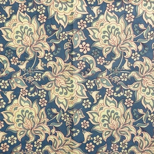 May include: A repeating floral pattern in shades of blue, cream, and peach. Large stylized flowers and smaller blossoms are arranged across the surface. The design has a vintage, slightly faded appearance, suggesting a classic textile or wallpaper.