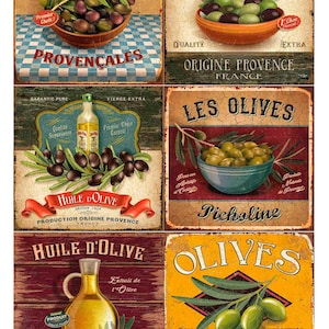 May include: A collection of vintage French-style signs advertising olives and olive oil. The signs feature text such as "Les Olives" and "Huile d'Olive," with images of olives in bowls and bottles of olive oil. The signs have a rustic aesthetic.