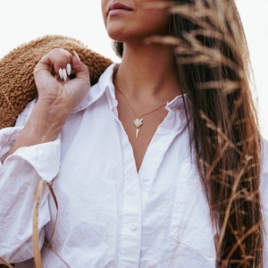 The Raw Stone Geode Spear Necklace is the perfect statement and a perfect length, with room for any neckline. 16in with a built in 2in extension to adjust for your varying preferences.