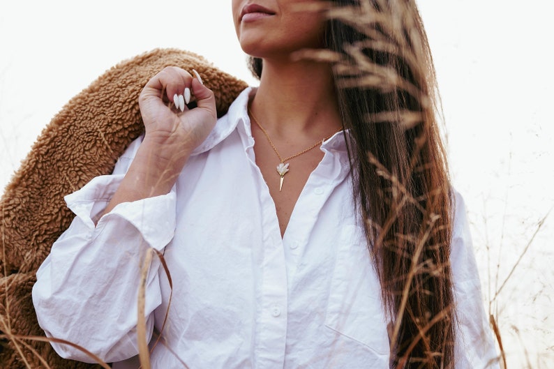 The Raw Stone Geode Spear Necklace is the perfect statement and a perfect length, with room for any neckline. 16in with a built in 2in extension to adjust for your varying preferences.