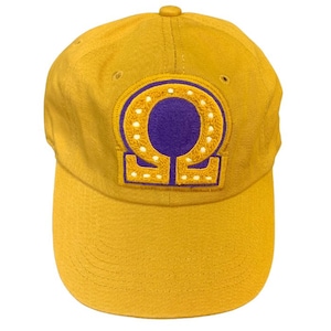 Gold Omega Chenille Cap relaxed with omega symbol, lamp or number
