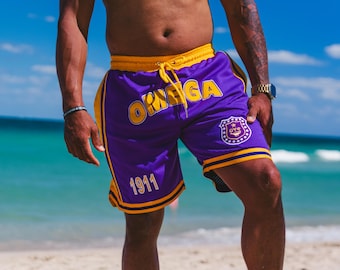 Omega Psi Phi Embroidered Purple Shorts with Gold Stripes