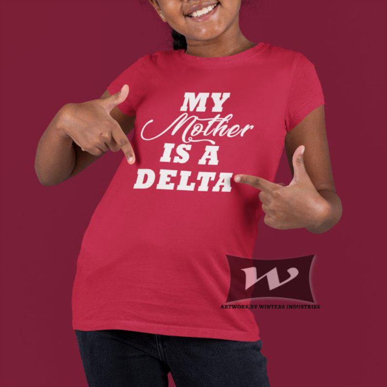 May include: Red t-shirt with white text that reads "My Mother is a Delta".