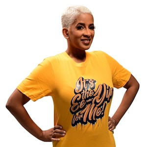 May include: A yellow t-shirt with a graphic print that says "It's the Drip for Me!" in black and orange lettering with a dripping effect.