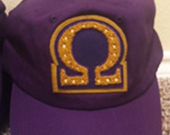 Purple Omega Chenille Cap relaxed with omega symbol, lamp or number