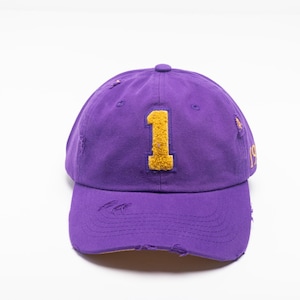 Purple Omega Chenille Cap relaxed with omega symbol, lamp or number
