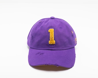Purple Omega Chenille Cap relaxed with omega symbol, lamp or number