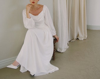 Vestido de novia Florence de satén con mangas largas abullonadas y largo hasta el suelo, escote cuadrado y cintura baja.