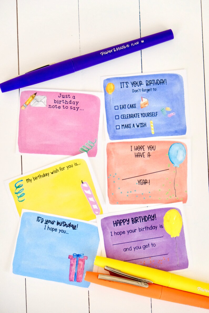 May include: Five watercolor birthday cards with different designs. The cards are all rectangular and have a white border. The designs include a birthday cake, a balloon, a candle, a gift, and a pencil and envelope. The cards are all blank inside for writing a message.