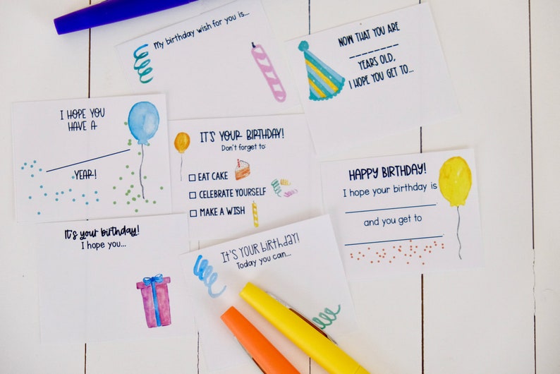 May include: A set of printable birthday cards with watercolor illustrations of balloons, cake, and gifts. The cards have fill-in-the-blank spaces for personalized messages.