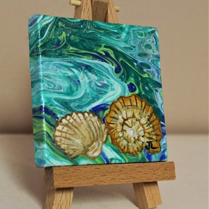3x3 canvas.Conch shell and clam shell Acrylic Painting over an original acrylic Pour painting with easel