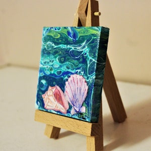 3x3 canvas.Conch shell and clam shell Acrylic Painting over an original acrylic Pour painting with easel