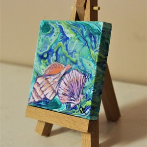 3x3 canvas.Conch shell and clam shell Acrylic Painting over an original acrylic Pour painting with easel