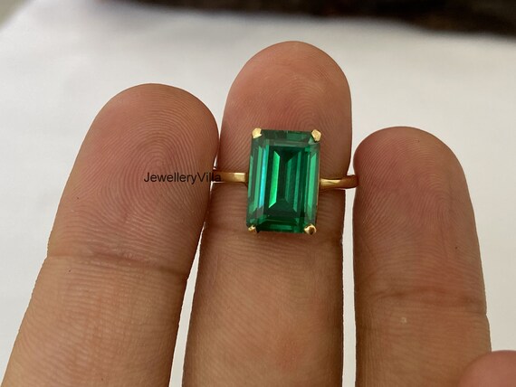 Green stone ladies best sale ring