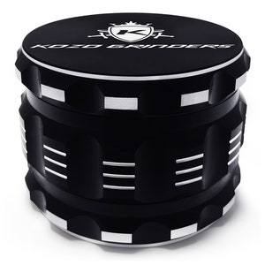 May include: Black metal grinder with a silver trim and the words "KOZO GRINDERS" and a logo with a crown and a "K" on the top.