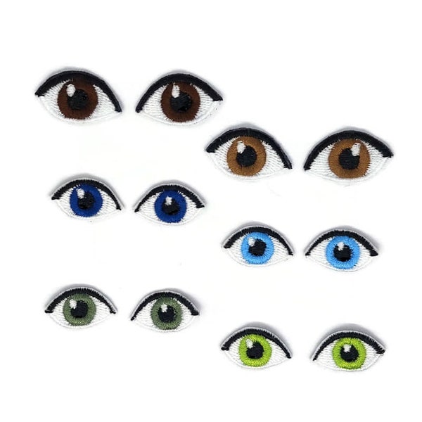 Embroidered dolls eyes .