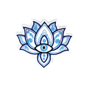 May include: Blue and white embroidered patch featuring a stylised eye in the centre of a lotus flower design.