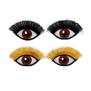 Embroidered eyes with eyelashes.