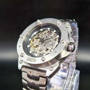 Unusual industial style skeleton watch for man. 41mm case diameter. Mechanical automatic Seiko movement. Stainless steel bracelet. RACE-41