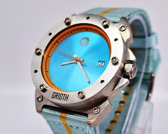 Unusual race and rally watch for man. Mechanical automatic movement. 41mm case diameter. Blue and orange.