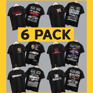 May include: A collection of six black t-shirts featuring automotive designs. Each shirt displays a car brand logo on the front and a detailed technical illustration of a specific vehicle model on the back, including Toyota, Nissan, Porsche, Honda, and Bugatti.