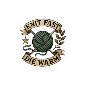 May include: A sticker featuring a green yarn ball with crossed knitting needles. The text "KNIT FAST DIE WARM" is displayed on banners above and below the yarn ball, with a star and leaves completing the design.