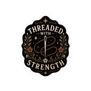 May include: A sticker with a black background and a decorative border. The sticker features the text "THREADED WITH STRENGTH" in a stylized font, along with a needle and thread design. Floral and star elements complete the design.