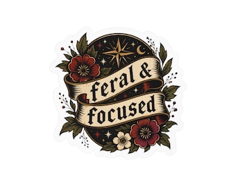 Könnte beinhalten: Ein runder Aufkleber mit schwarzem Hintergrund, einer goldenen Stern- und Mondsichelgrafik. Ein beiges Bannerband in der Mitte zeigt den schwarzen Schriftzug 'feral & focused'. Das Design ist von roten und weißen Blüten sowie grünen Blättern umrahmt.
