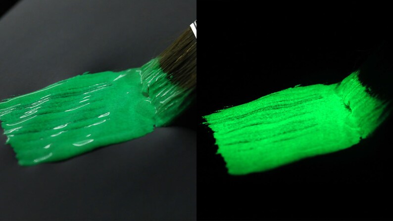 May include: A green paint brush stroke glows brightly in the dark, demonstrating the paint's glow-in-the-dark properties.