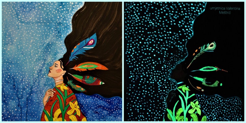 May include: A woman with long dark hair and colorful feathers in her hair is looking up at a blue starry sky. The image is split in two, showing the same scene in normal light and in glow-in-the-dark paint.
