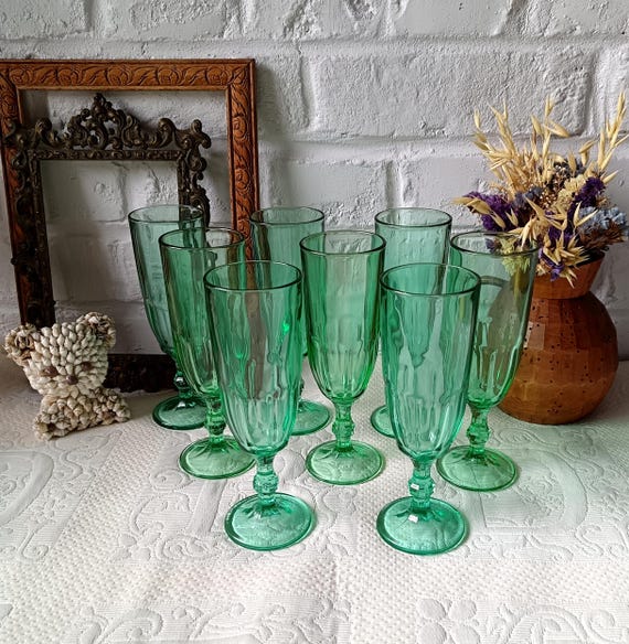 8 vintage champagne flutes in emerald green colored glass