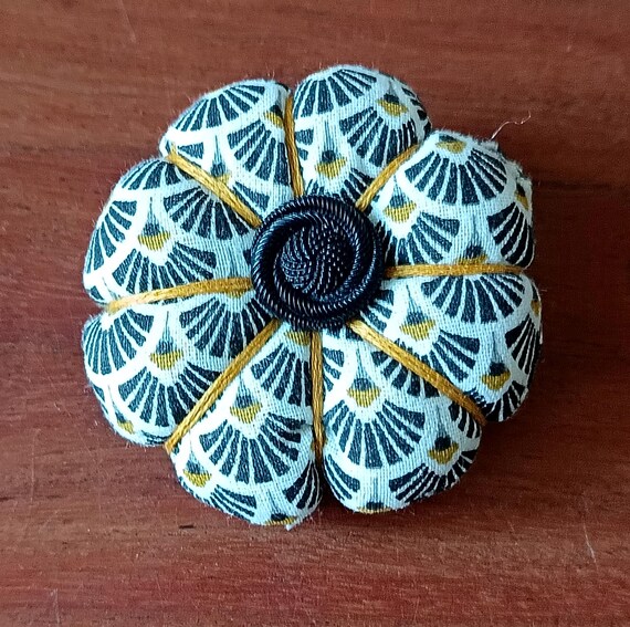 Pumpkin-shaped fabric brooch, hand-sewn