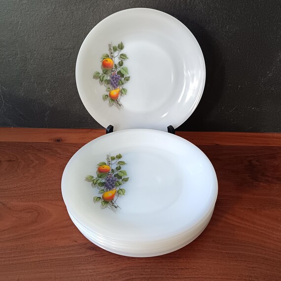 8 French opaline Arcopal flat plates with "fruits of France" motif