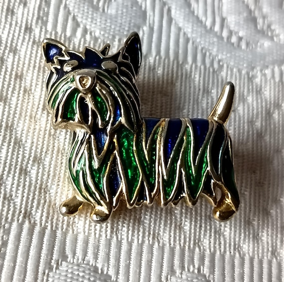 Round clip brooches in gold-tone metal and navy blue enamel