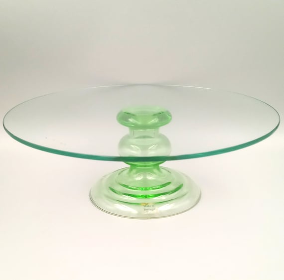 Vintage green glass cake stand on a stand in Portugal