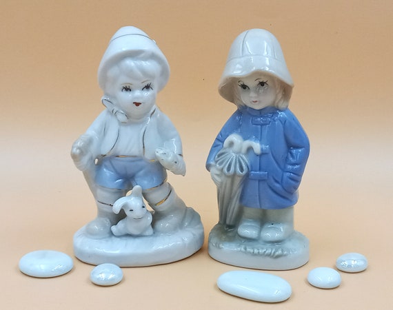 Vintage ceramic boy and girl figurine pair, blue and white, porcelain goose